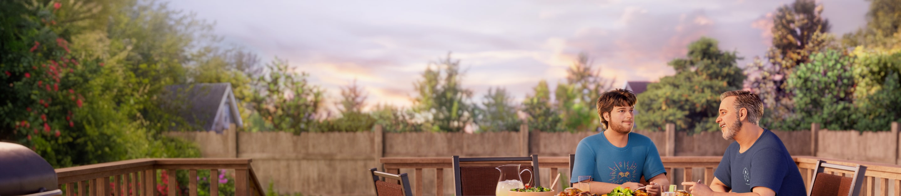 Dad and teenage son eating dinner outside on their patio